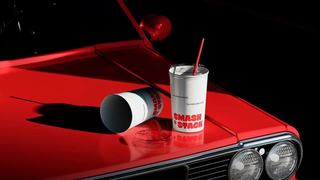 seedance-2.0_Create_a_smooth_cinematic_animation_of_the_Smash_Stack_drink_cups_placed_on_a_gl-0.mp4